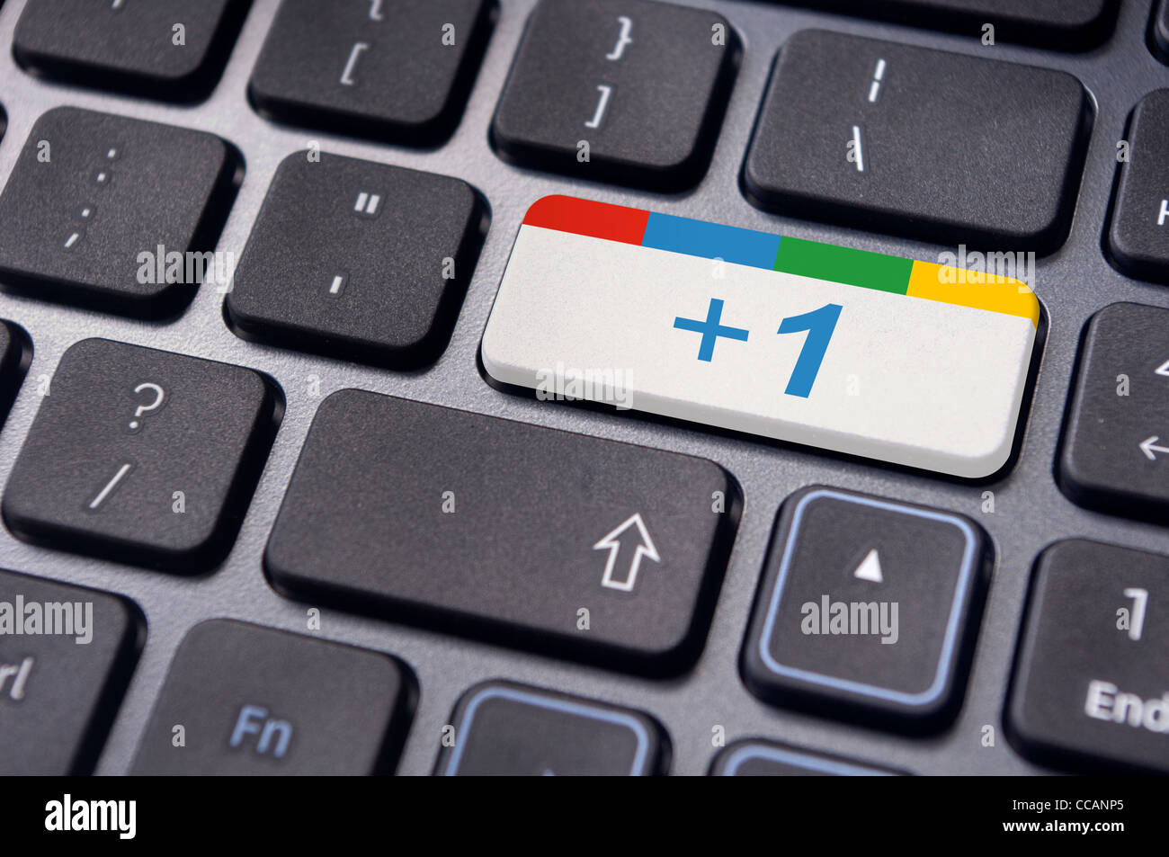 Tastatur eingeben Schlüssel mit Google plus eine Symbole für social-Media-Konzepte. Stockfoto