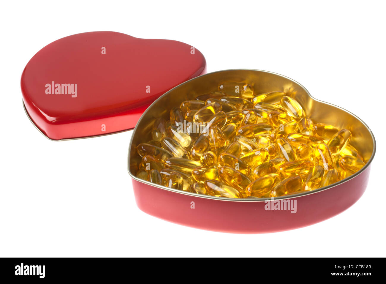 gelbe Arzneimittel in einer Herzbox Stockfoto