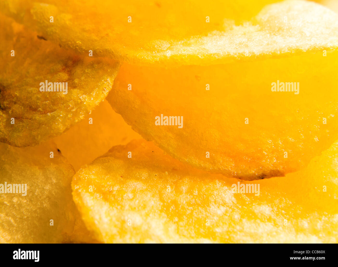 Hintergrund, Gebratene Kartoffel-Chips, Makro erschossen. Stockfoto