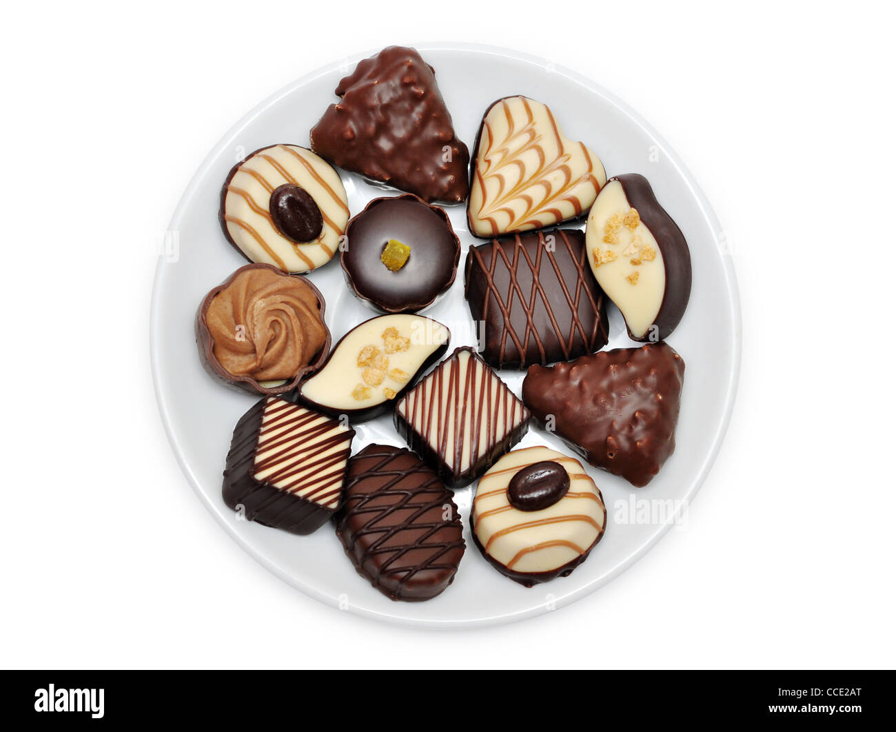 Schokolade Süßigkeiten auf einem Teller isoliert auf weißem Hintergrund Stockfoto