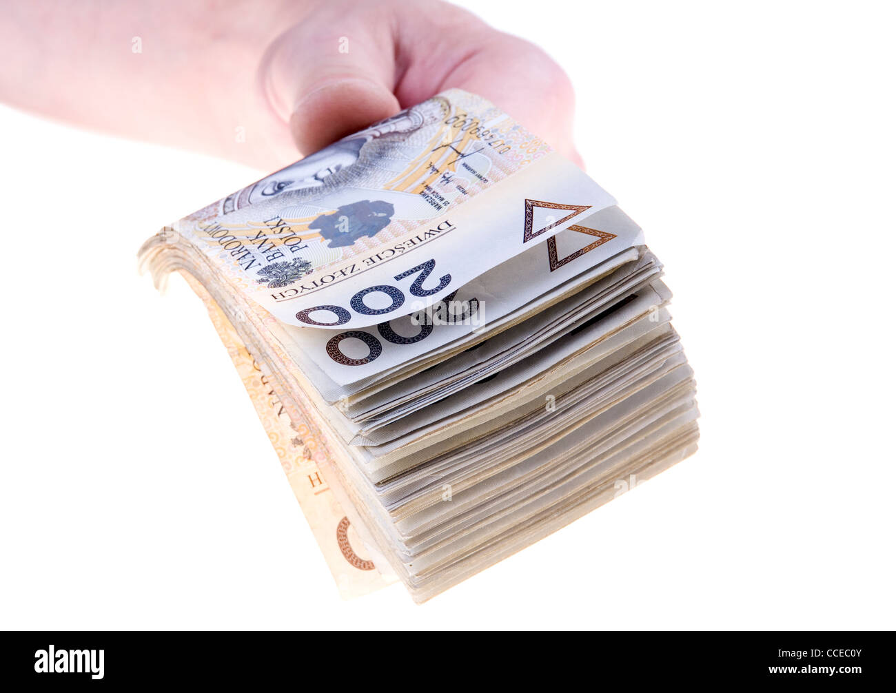 Stapeln von zweihundert polnischer Zloty in der hand Banknoten isoliert auf weißem Hintergrund Stockfoto