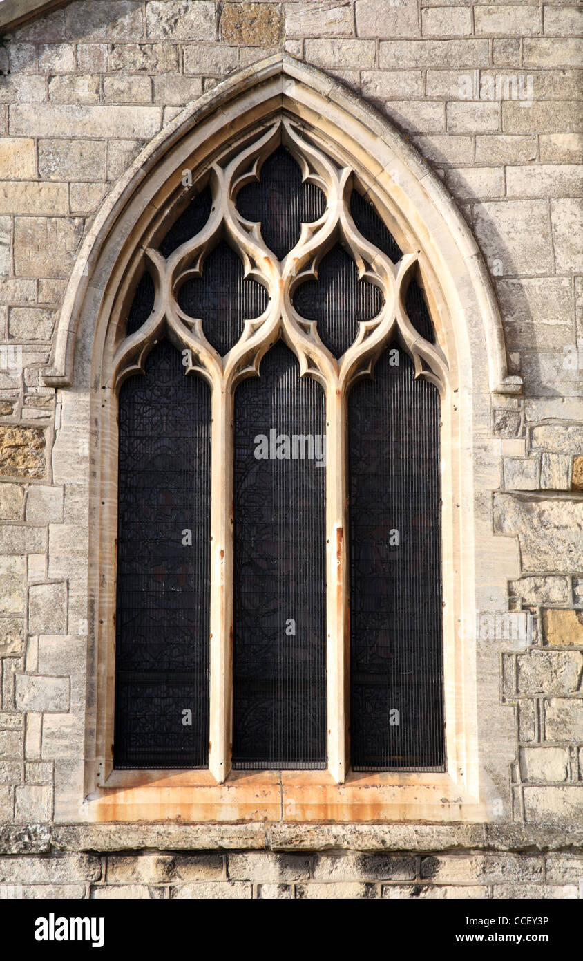 Netzartige Maßwerk in einem Fenster der Holy Trinity Church, Barrow auf Humber, Lincolnshire, England Stockfoto