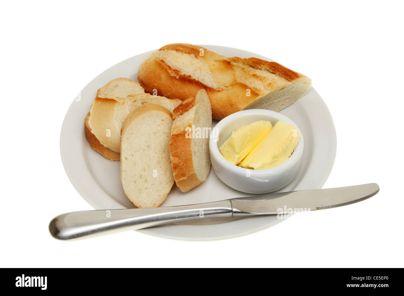 Brot und Butter in einem Töpfchen mit einem Messer auf einen Teller isoliert gegen weiß Stockfoto