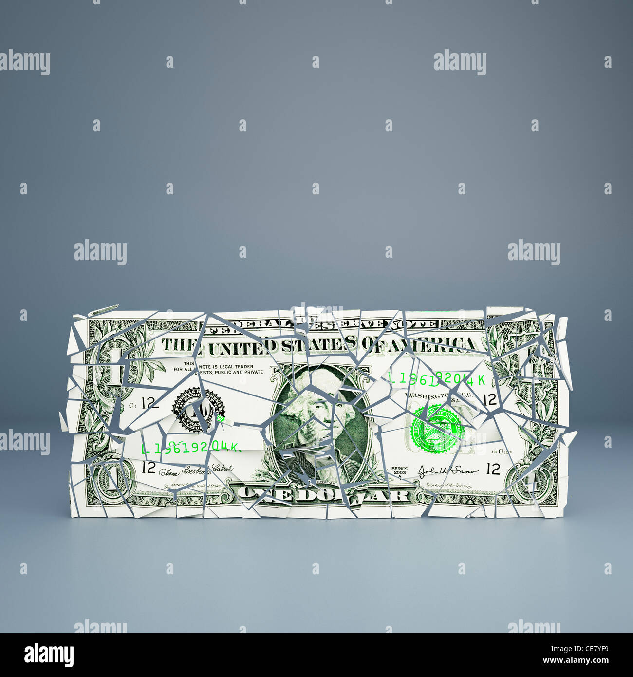 Die US-Wirtschaft - die Dollarrechnung zerbröckelt - repräsentiert einen fragilen Wirtschaftszustand, Währung, Schuldenkonzept Stockfoto