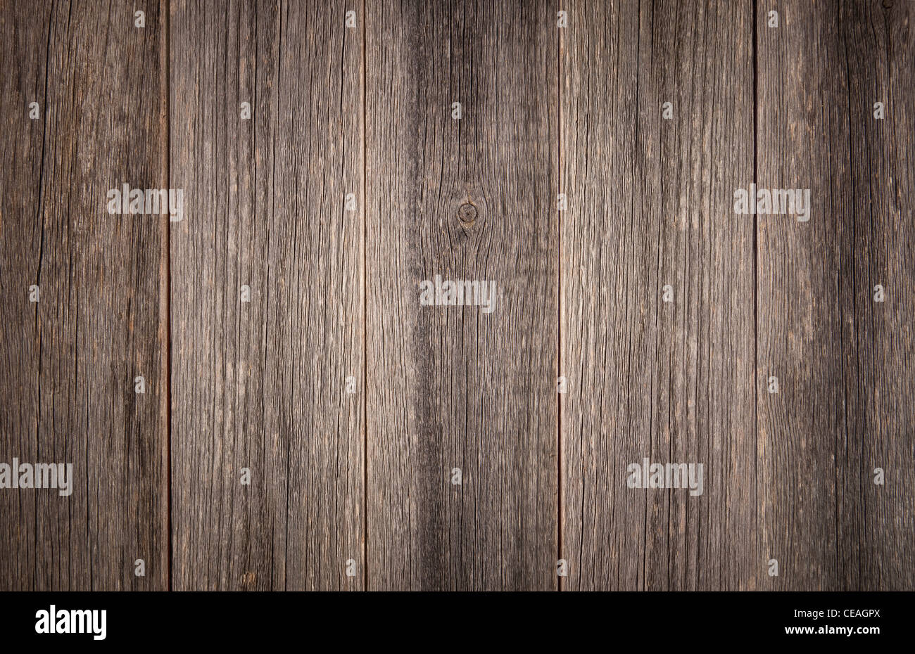Verwitterte graue Hintergrund Detail der vertikalen Scheune Holzplatten. Stockfoto