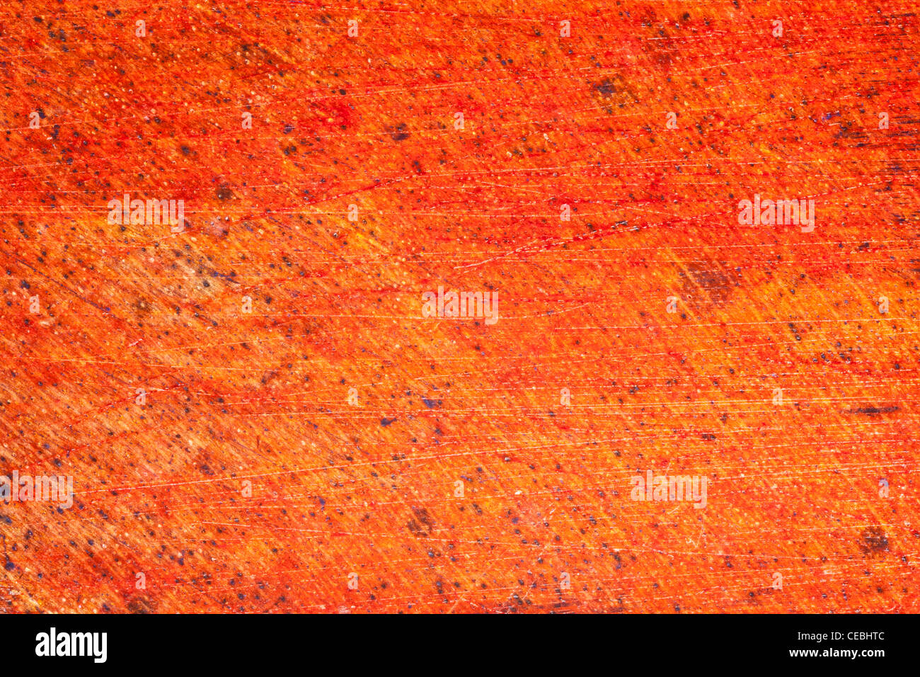 Makroaufnahme (2 Mal lebensgroße) Vintage Holzoberfläche, rot lackiert, gebeizt und zerkratzt Stockfoto
