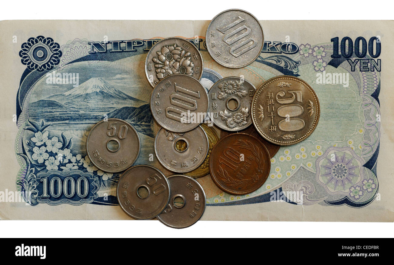 Japanische Yen-Banknoten und-Münzen Stockfoto