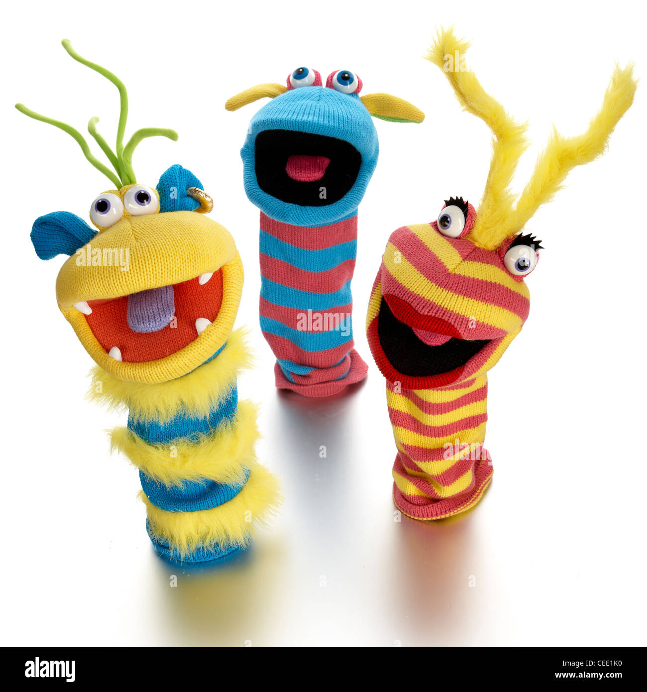 3 bunte lustige Handpuppen Stockfoto