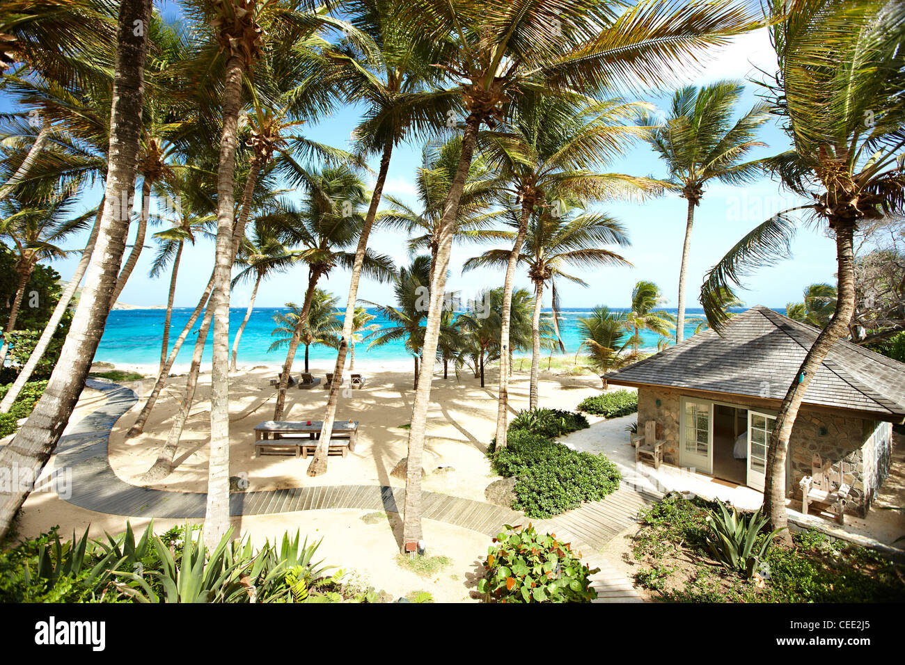 Inselparadies Strand private exklusive Mustique karibische Palmen abgeschieden keine Menschen Himmel Sand Meer verlassene Sonne Meer Hängematte blau Stockfoto