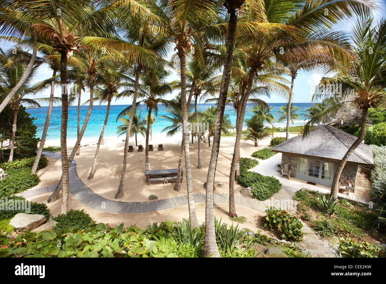 Inselparadies Strand private exklusive Mustique karibische Palmen abgeschieden keine Menschen Himmel Sand Meer verlassene Sonne Meer Hängematte blau Stockfoto