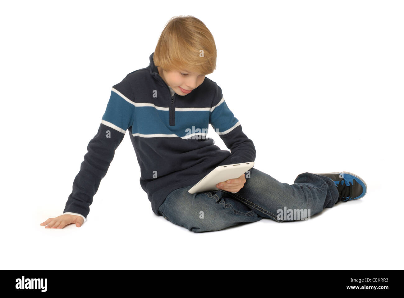 Elfjähriger Junge mit einem Tablet Computer. Stockfoto