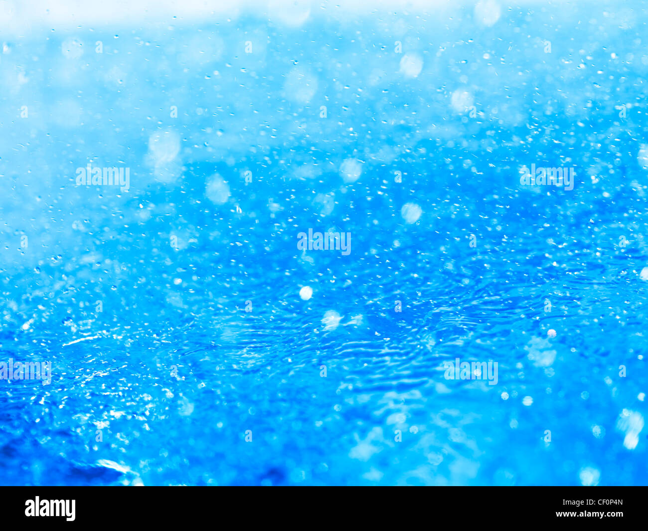 Spritzt Wasser Closeup abstrakte Hintergrundtextur blau Stockfoto