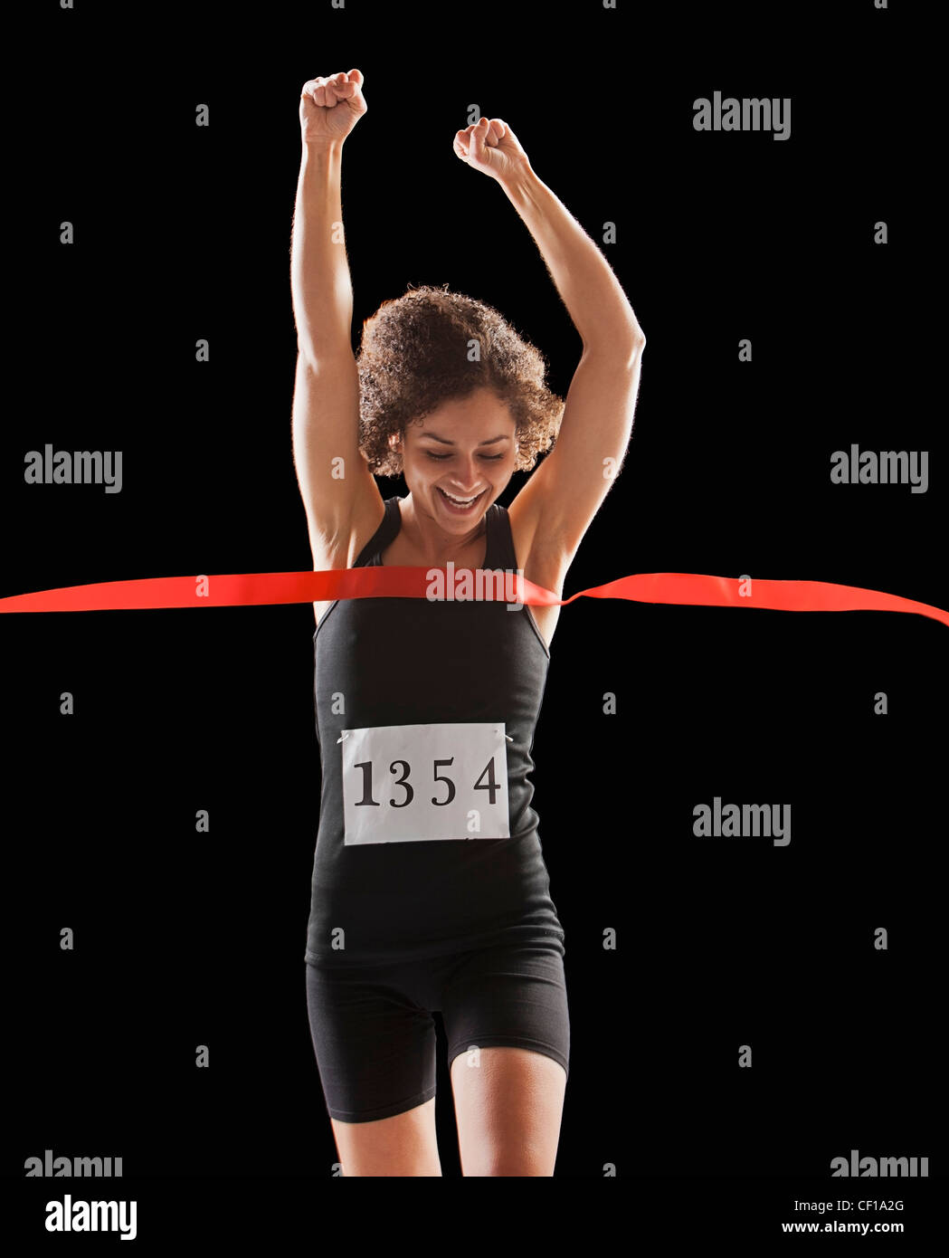 Kaukasische Frau Ziellinie Rennen läuft Stockfoto