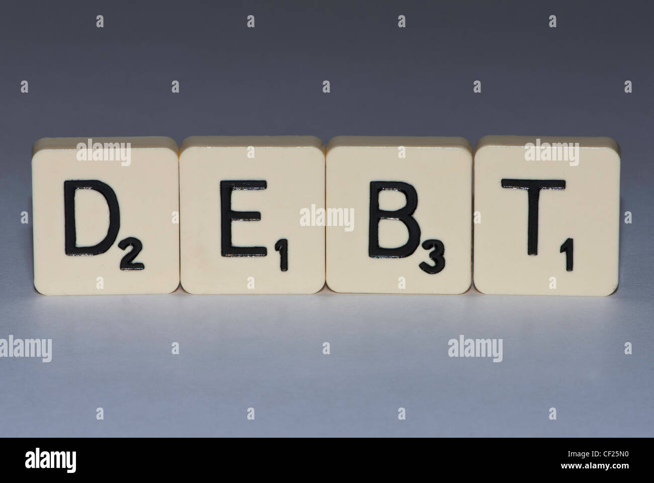 Buchstaben die Wort Schulden Stockfoto