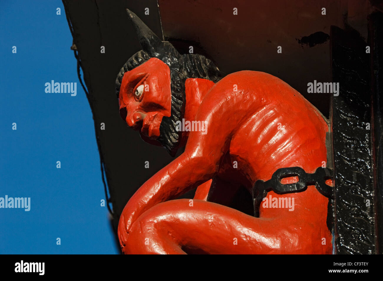 Rote Teufel Abbildung über einen ehemaligen Drucker laden, Stonegate. Stockfoto