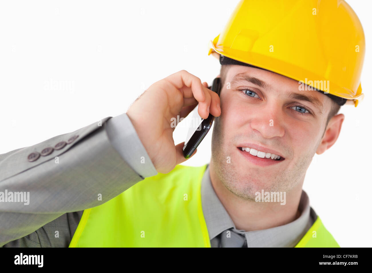 Nahaufnahme von einem jungen Erbauer einen Anruf tätigen Stockfoto