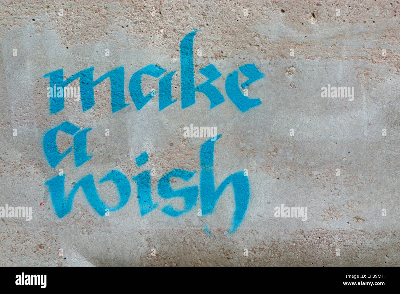 Graffiti "Make a Wish" an Wand, London UK. Stockfoto