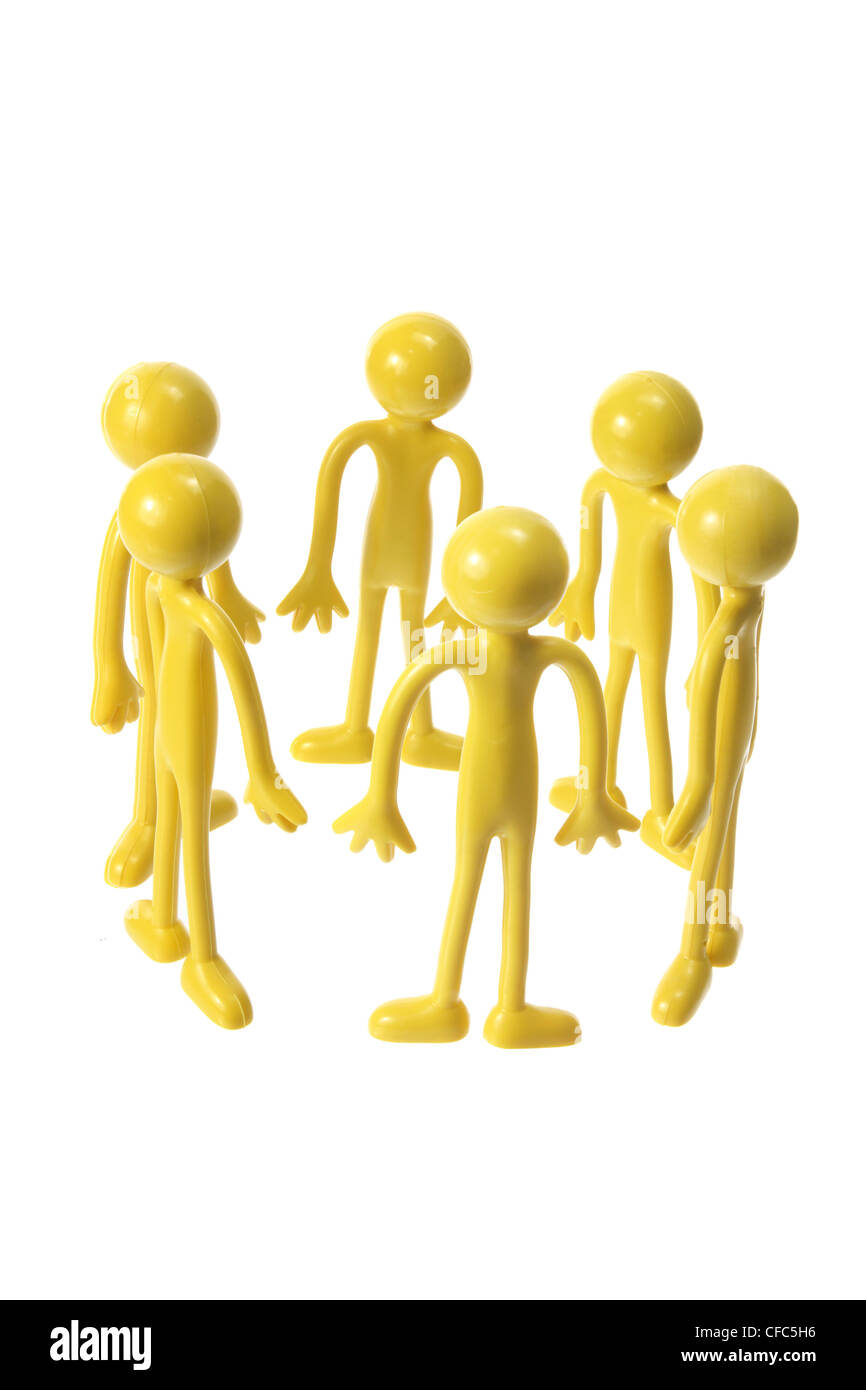 Miniatur-Rubber Figuren bilden Kreis Stockfoto