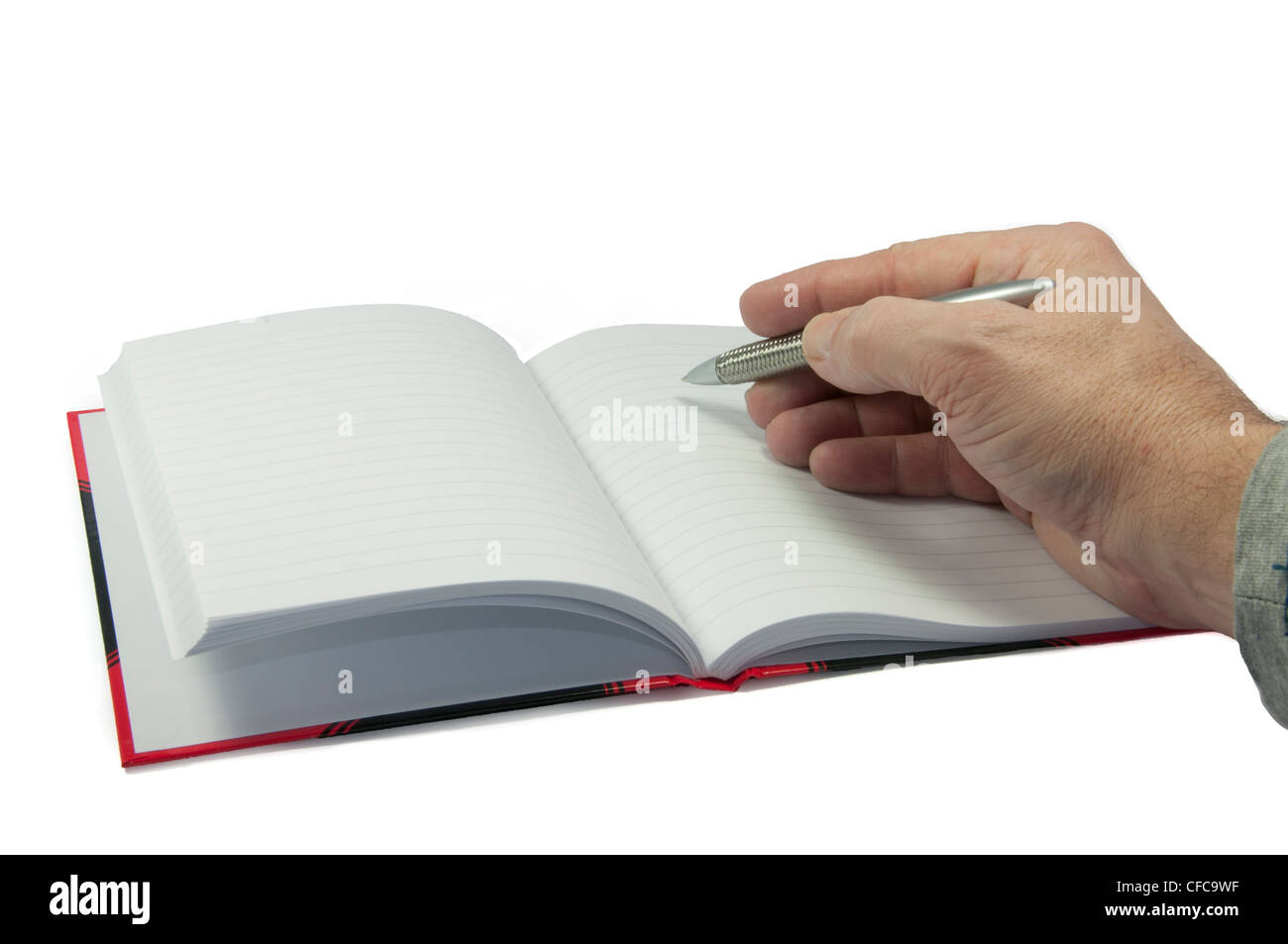 männliche Hand in leeres Buch schreiben Stockfoto