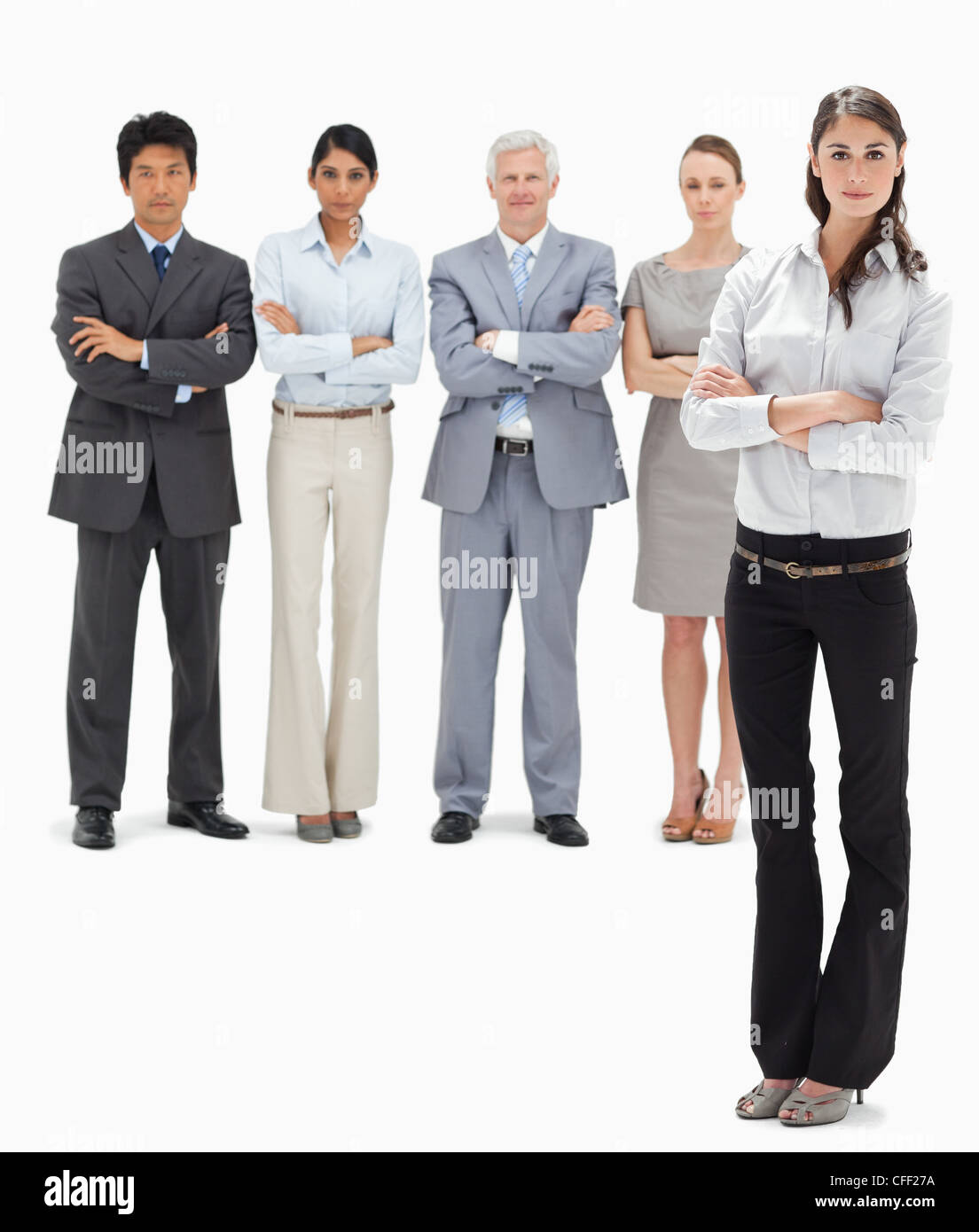 Business-Team mit ihren Armen gefaltet mit einer Frau im Vordergrund Stockfoto