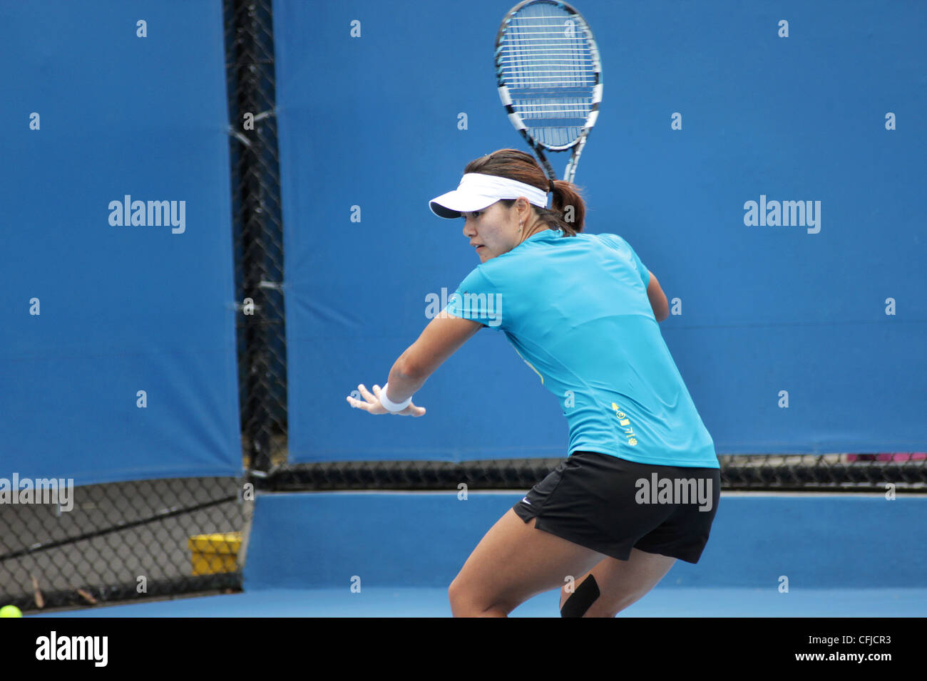 MELBOURNE, Australien - 21. Januar 2012: WTA-Nummer 4 Tennisspieler Li Na trifft auf einen Übungsplatz 21. Januar 2012. Stockfoto
