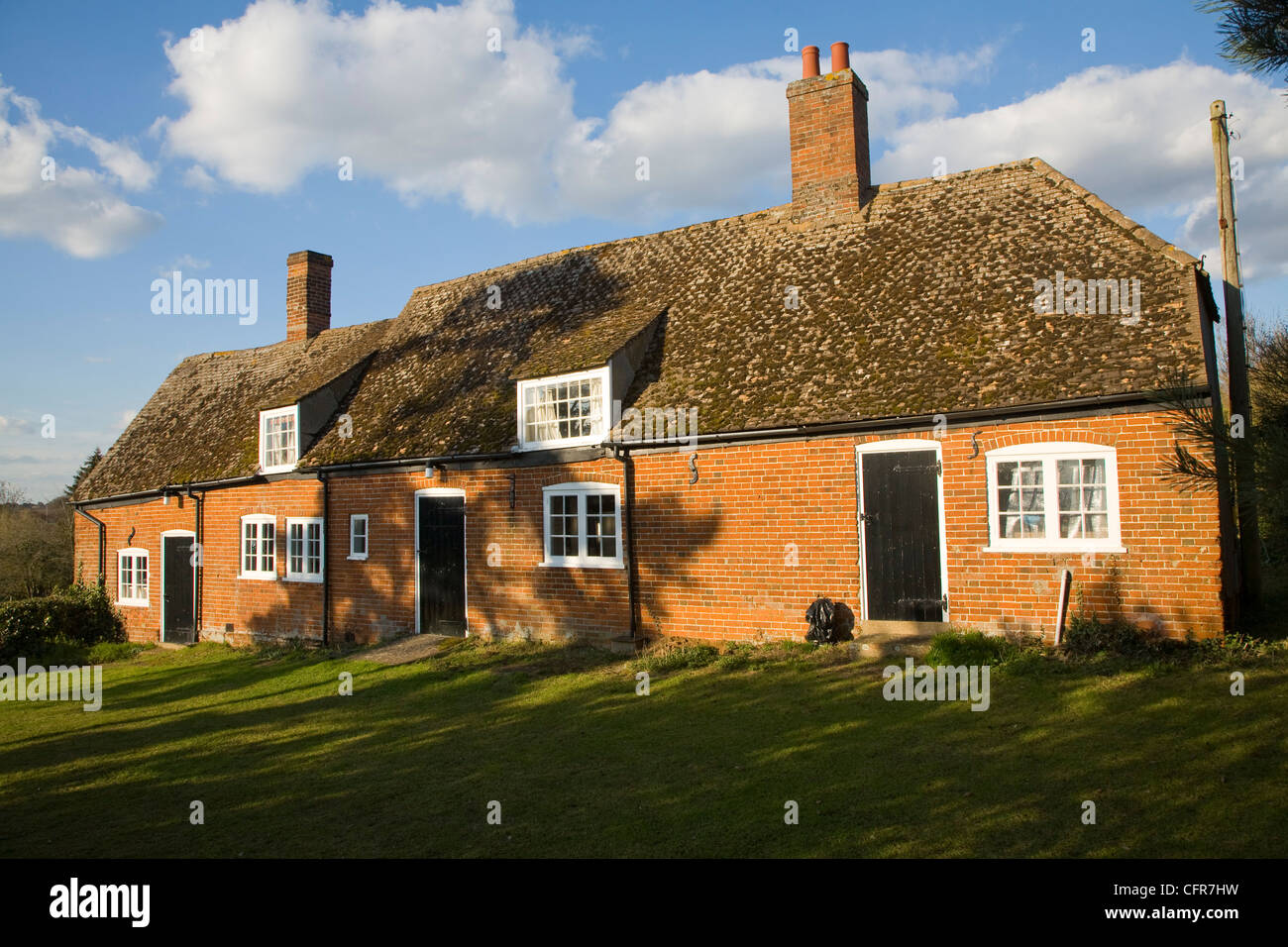 Ehemaligen Hütten fusionierten zur Form Dorfhalle, The Trust Hall, Shottisham, Suffolk, England Stockfoto