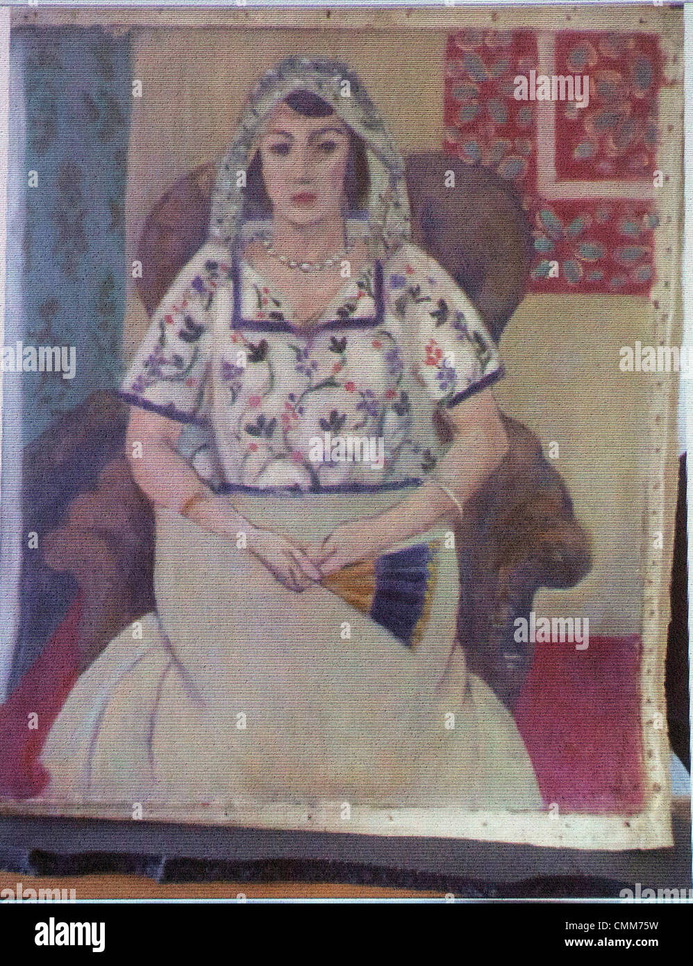 München, Deutschland. 5. November 2013. Das Bild des französischen Malers Henri Matisse mit dem Titel "sitzt Frau" während einer Pressekonferenz durch die Staatsanwaltschaft Augsburg auf spektakuläre Art auf eine Wand projiziert wird ein Kunstwerk finden in München, Deutschland, 5. November 2013. Foto: MARC Müller/Dpa (neu - ALTERNATIVE CROP) / Dpa/Alamy Live News Stockfoto