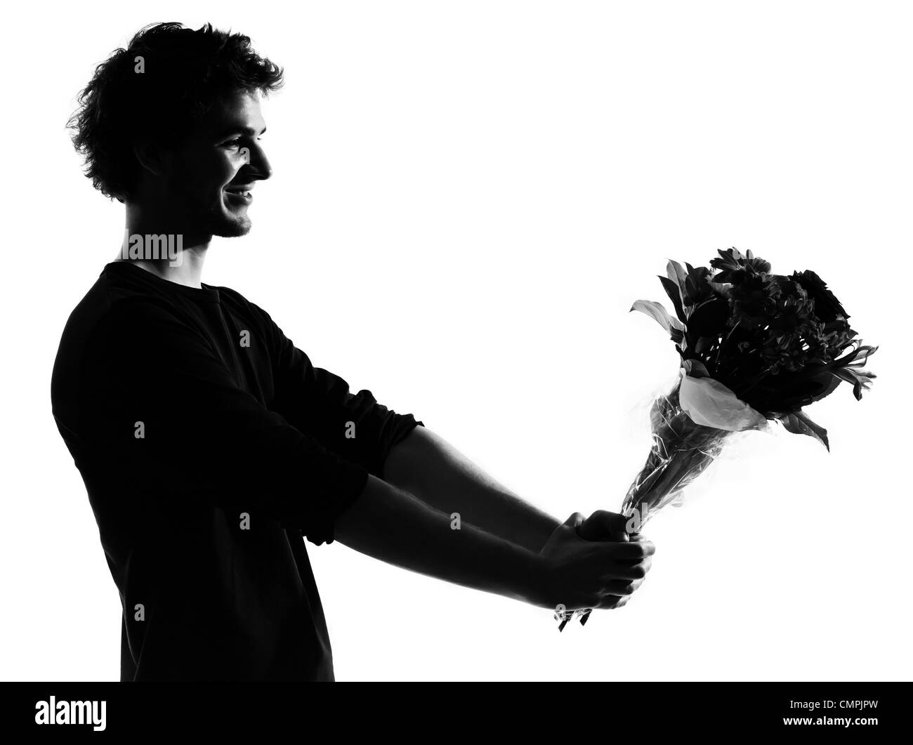 junger Mann mit Blumen Blumenstrauß Silhouette im Studio isoliert auf weißem Hintergrund Stockfoto