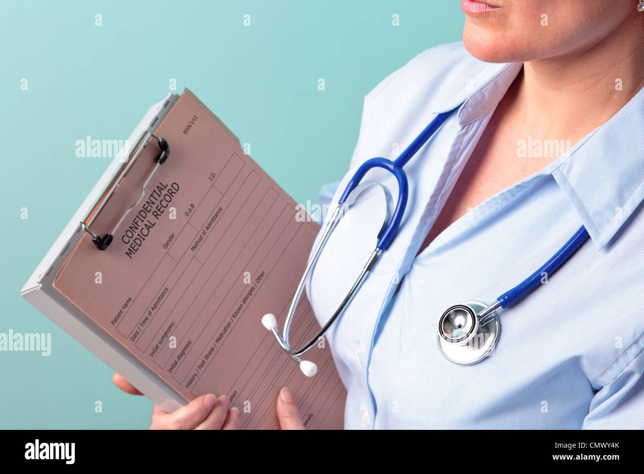 Photo of a female doctor holding a medical record Stockfoto