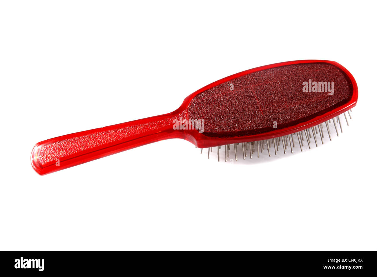 rotes Haarbürste auf weißem Hintergrund Stockfoto