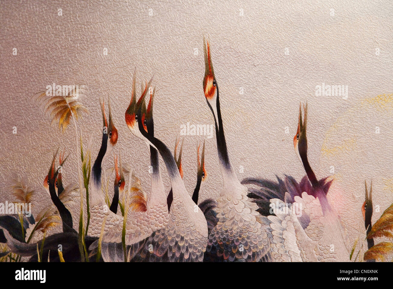 Stickerei-Stück mit Kränen, Vietnam Stockfoto