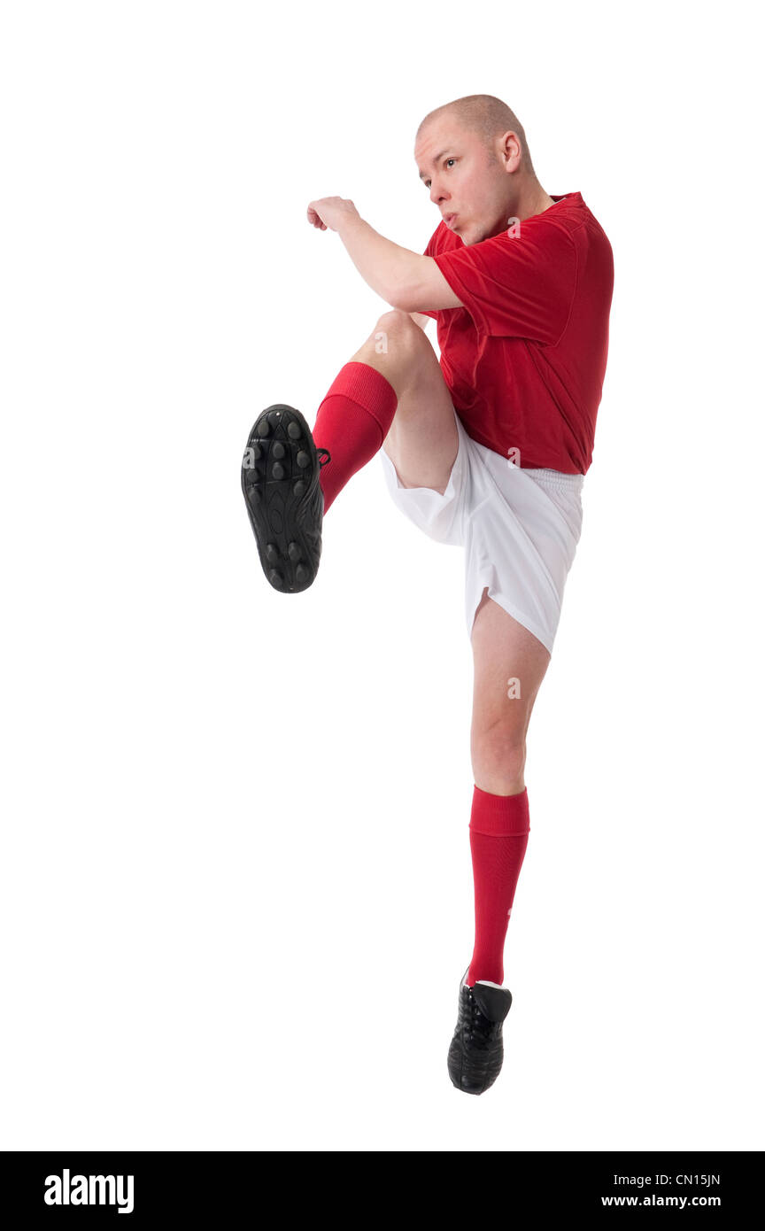 Voll isolierte Studio Bild von einem jungen Fußballspieler mit ball Stockfoto