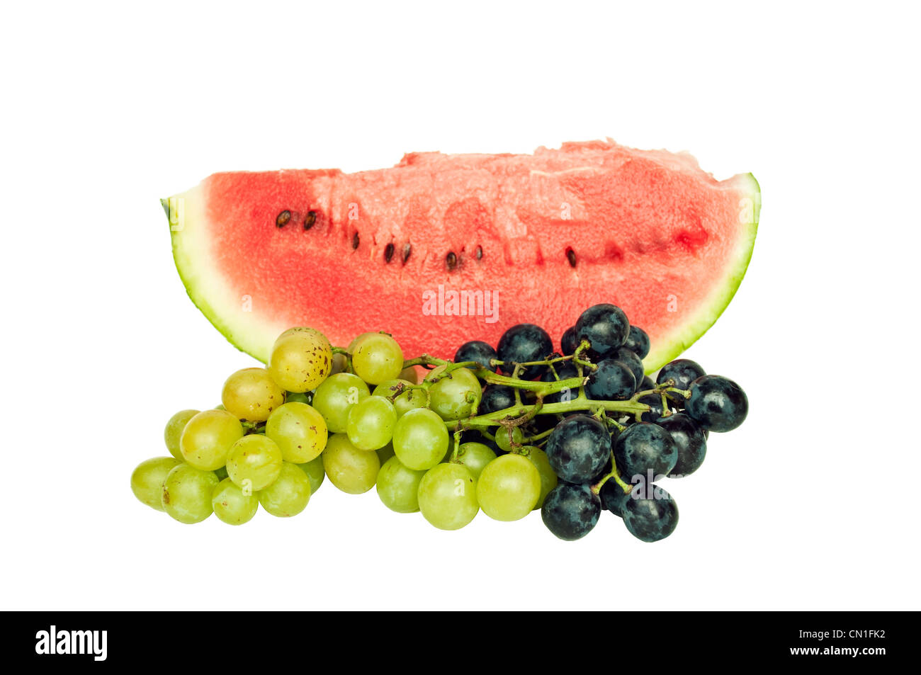 Frisches Obst - Wassermelone mit Trauben isoliert Stockfoto