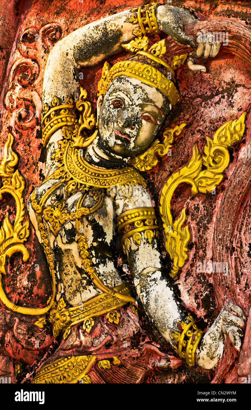 Mutter-Erde, einheimische Kunst an der Wand im Tempel geschnitzt. Stockfoto