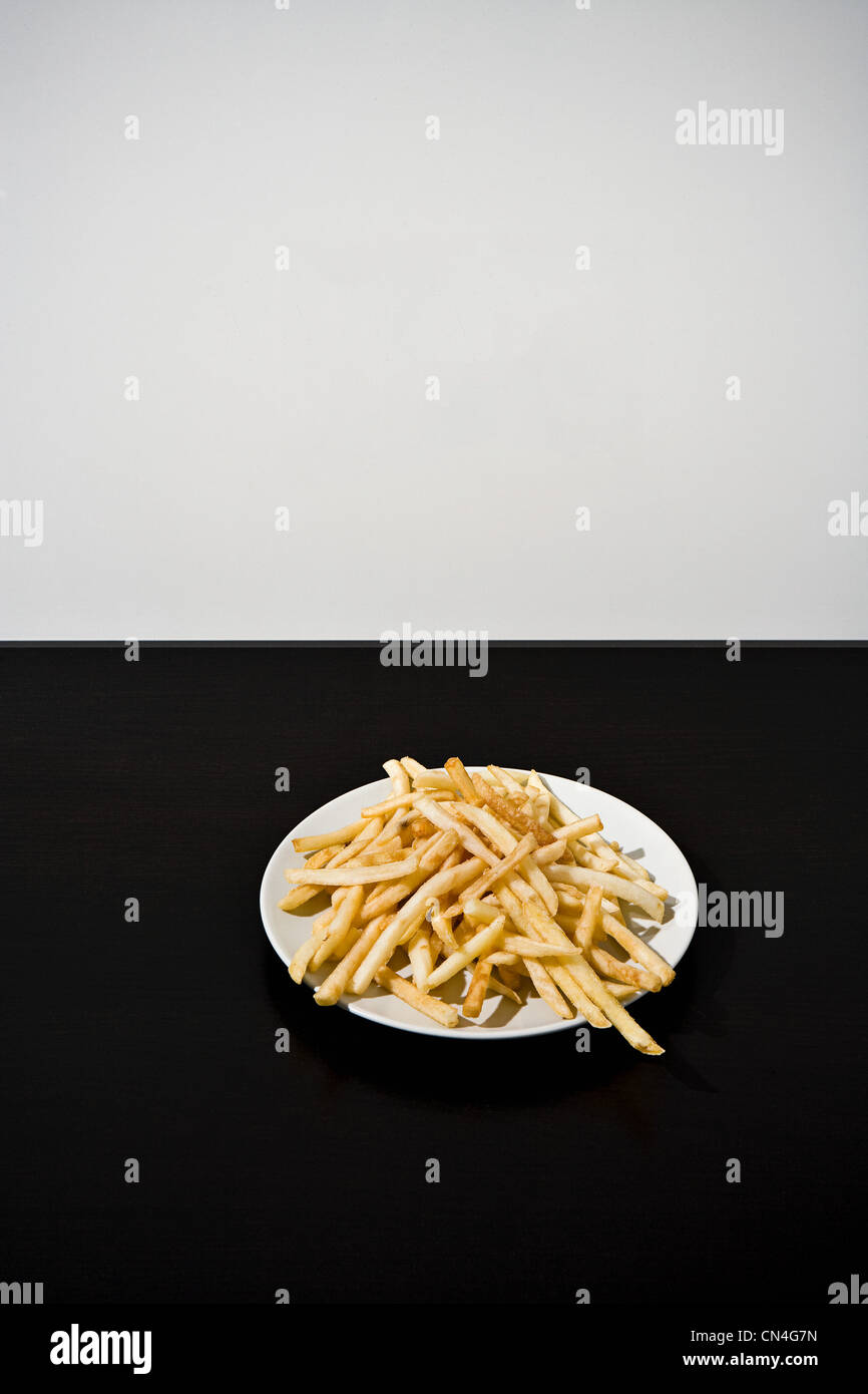 Pommes Frites auf Platte Stockfoto