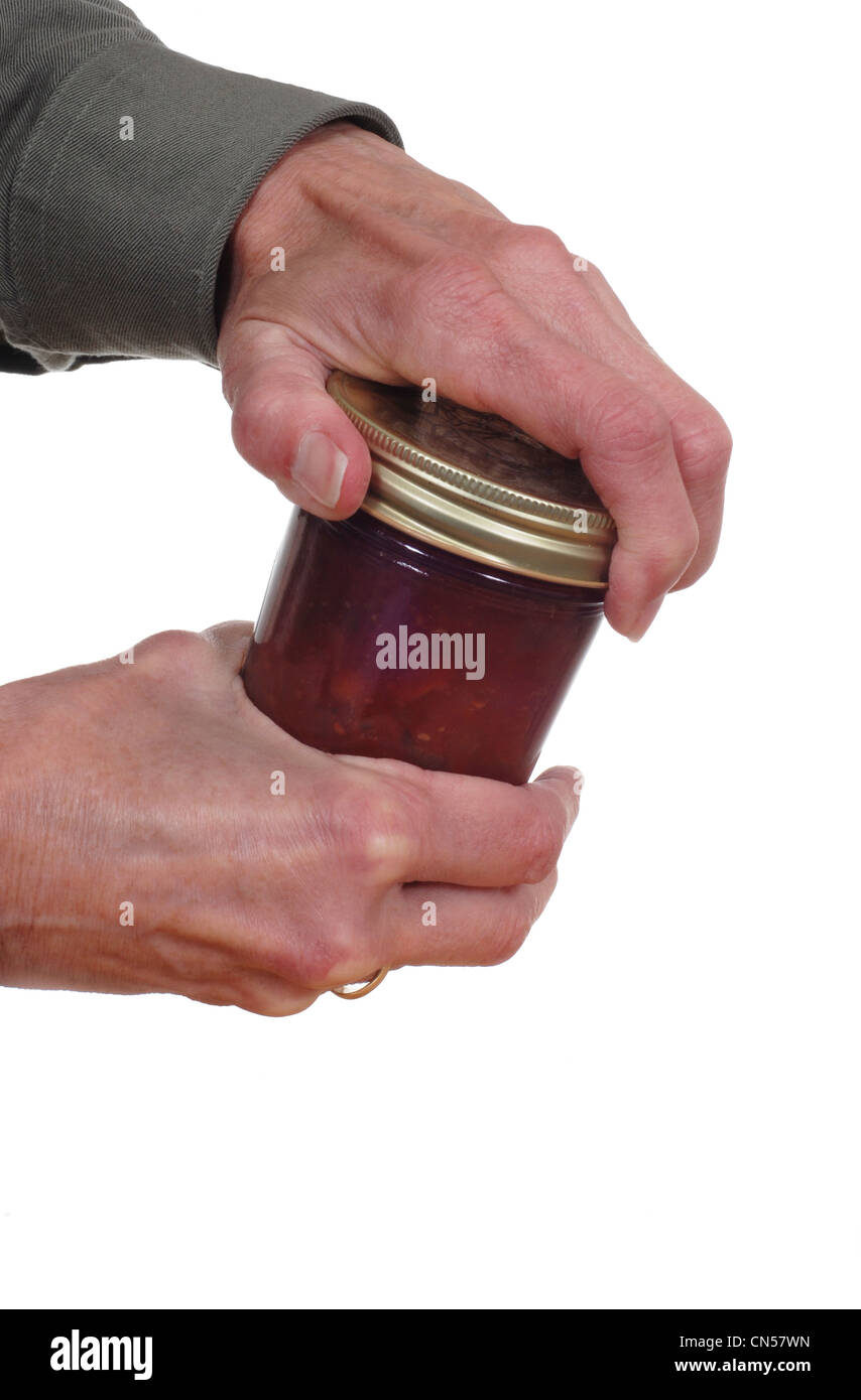 Nahaufnahme der Hand ein Glas zu öffnen. Stockfoto