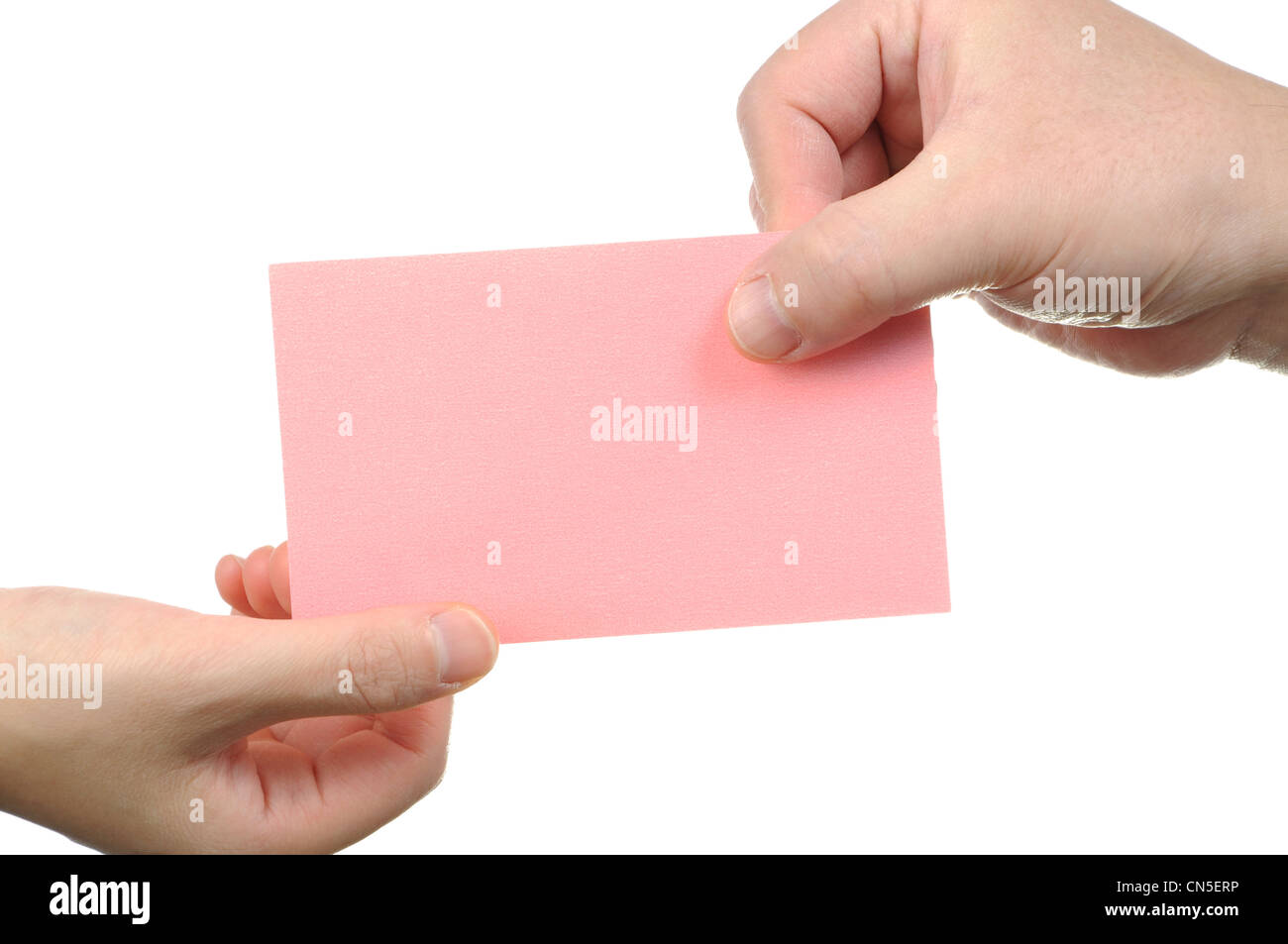 Übergabe der leeren rosa Visitenkarte Stockfoto