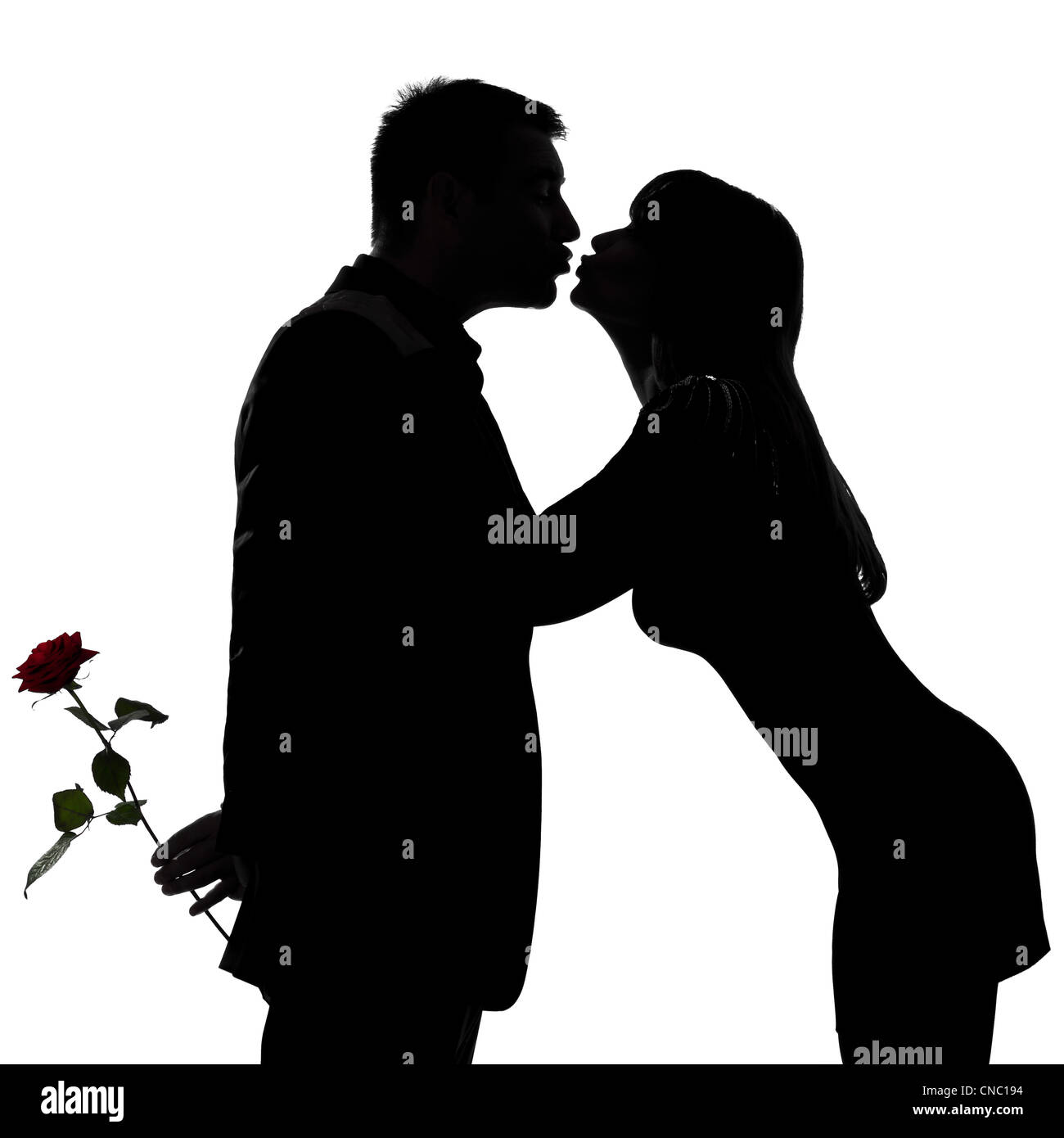 eine kaukasische paar Mann und Frau küssen im Studio Silhouette isoliert auf weißem Hintergrund Stockfoto