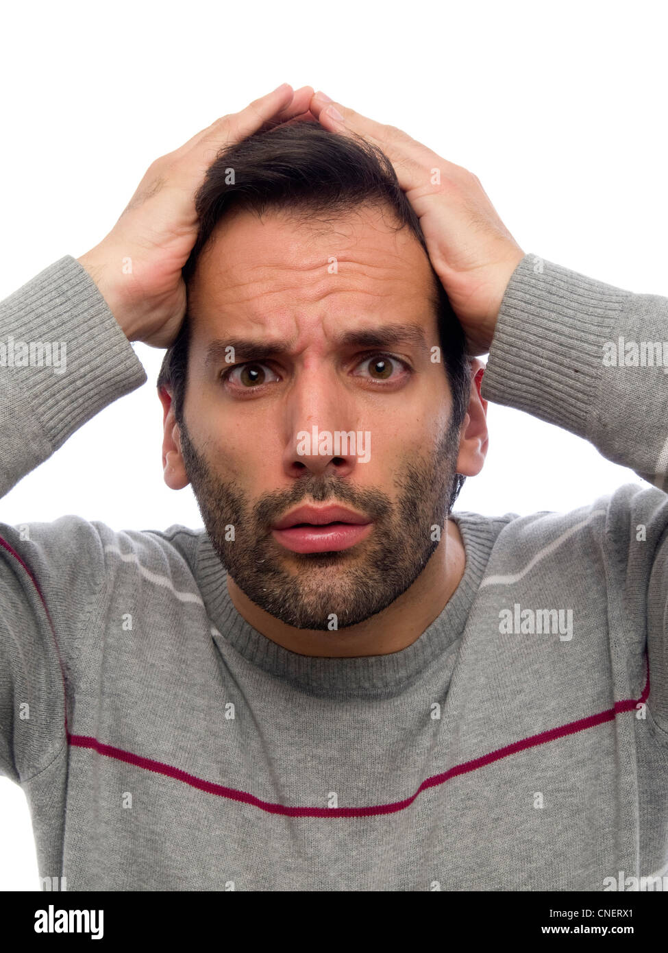 Porträt eines jungen Mannes mit Bart, Blick in die Kamera überrascht Stockfoto