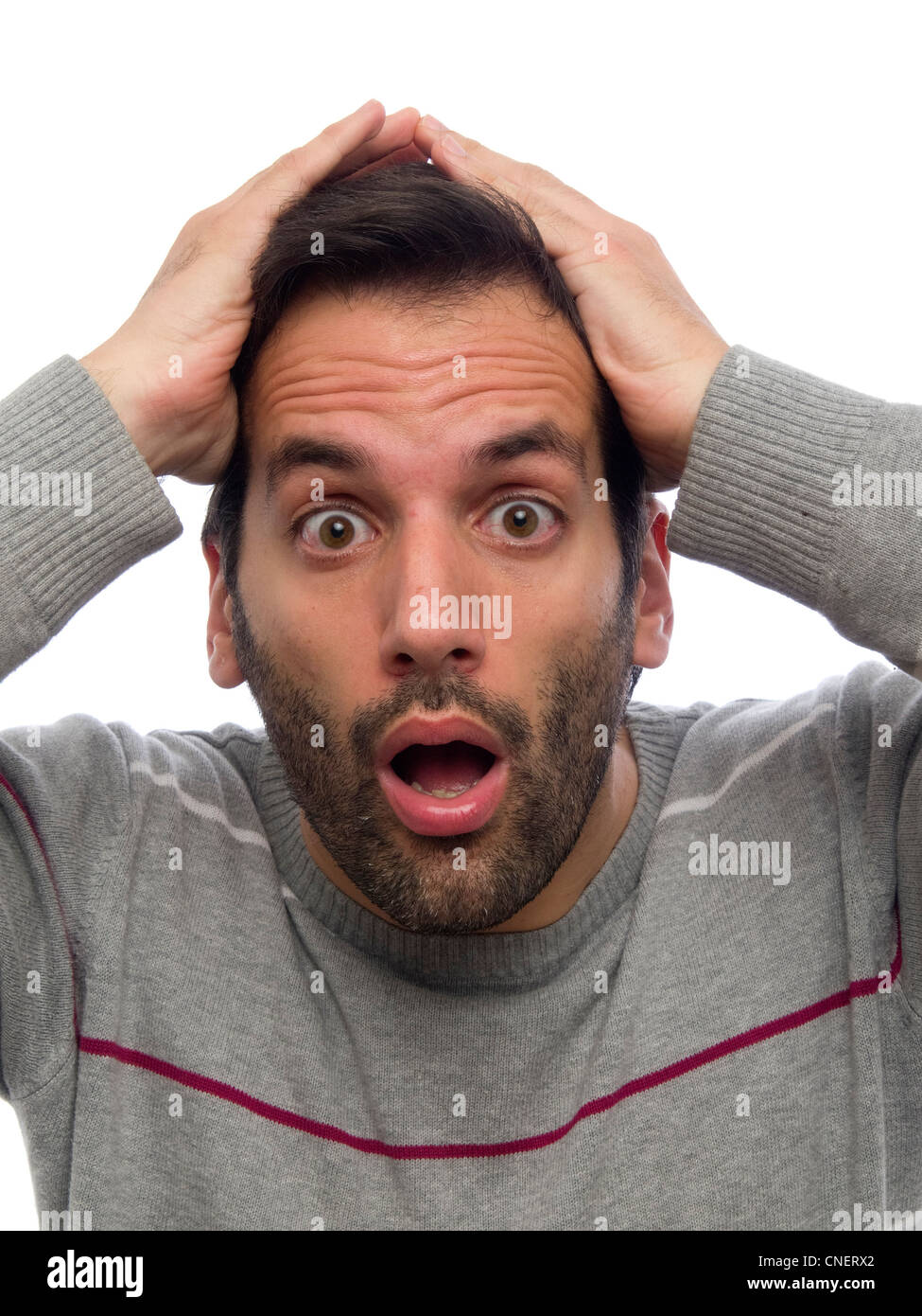 Porträt eines jungen Mannes mit Bart, Blick in die Kamera überrascht Stockfoto