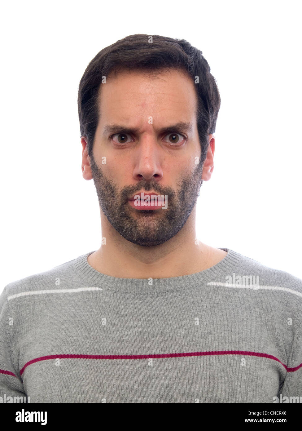 Porträt eines jungen Mannes mit Bart, Blick in die Kamera überrascht Stockfoto