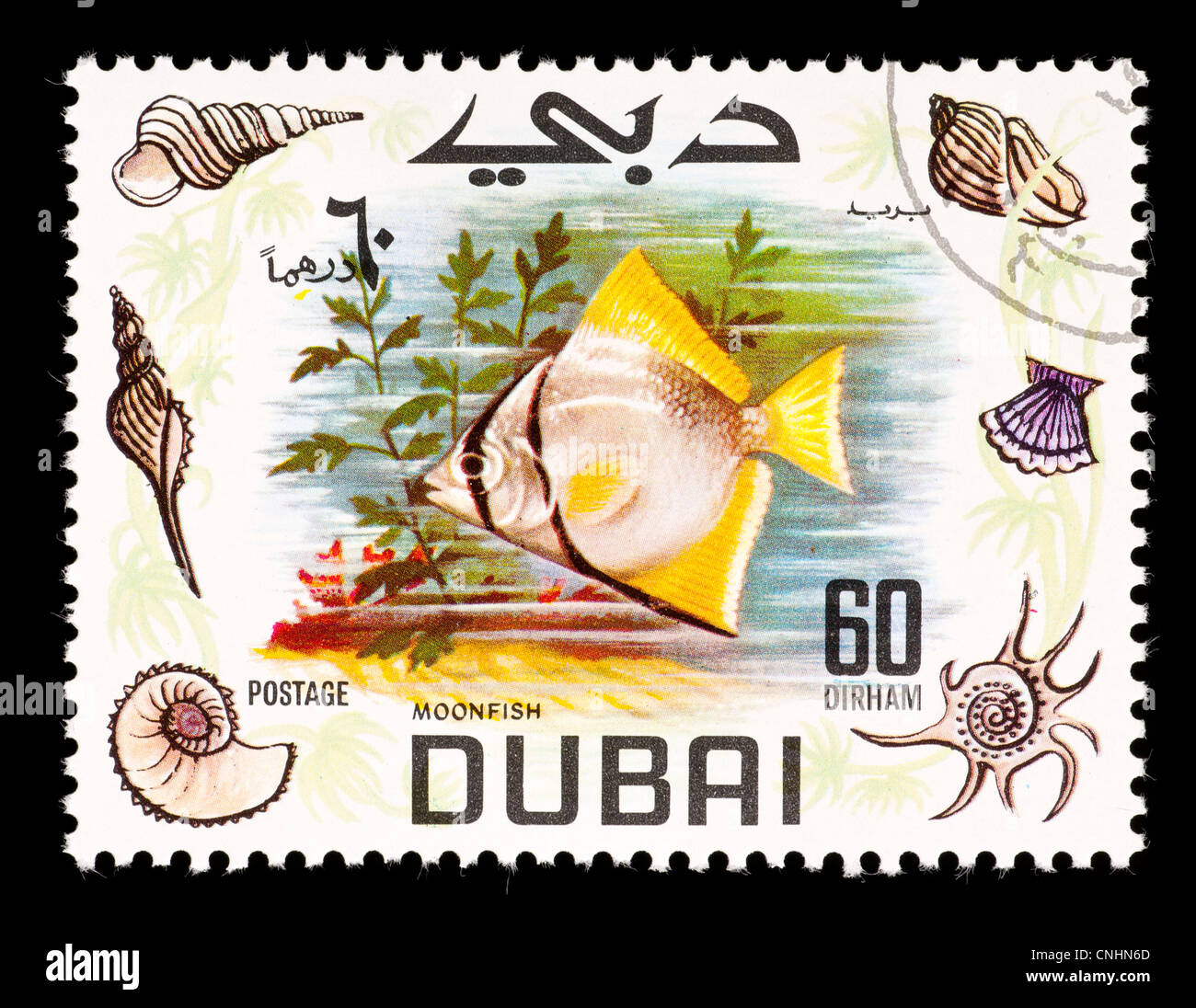 Briefmarke aus Dubai ein Moonfish darstellt. Stockfoto