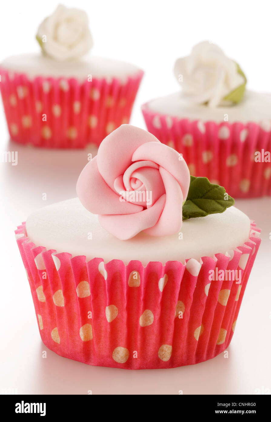 ROSA UND WEIßE ROSE CUPCAKE Stockfoto