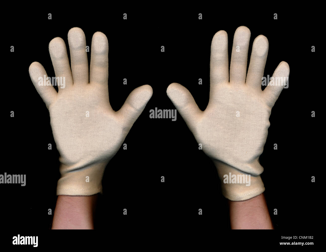 Zwei Hände mit weißen Handschuhen, statt sich um zu ergeben, symbolische Foto Stockfoto