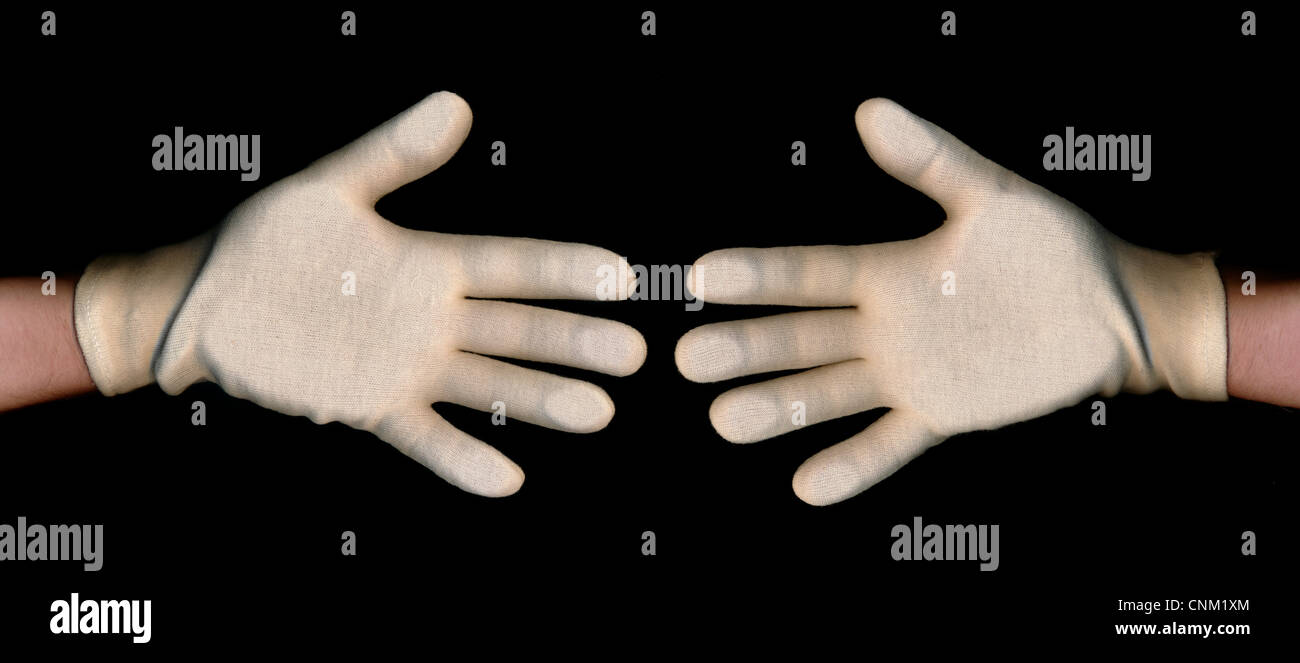 Zwei Handschuhe, schüttelt Hände, symbolisches Bild, Bäckerlehrling Schütteln, Begrüßung, Symbolbild Stockfoto