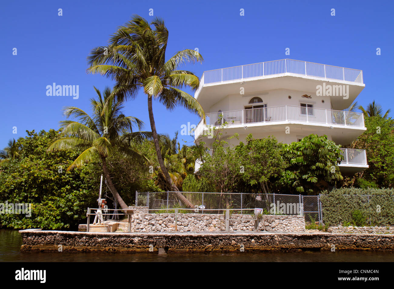 Florida Upper Key Largo Florida Keys, Largo Sound Canal, Häuser am Wasser, Palmen, Besucher reisen Reise touristischer Tourismus Wahrzeichen Land Stockfoto