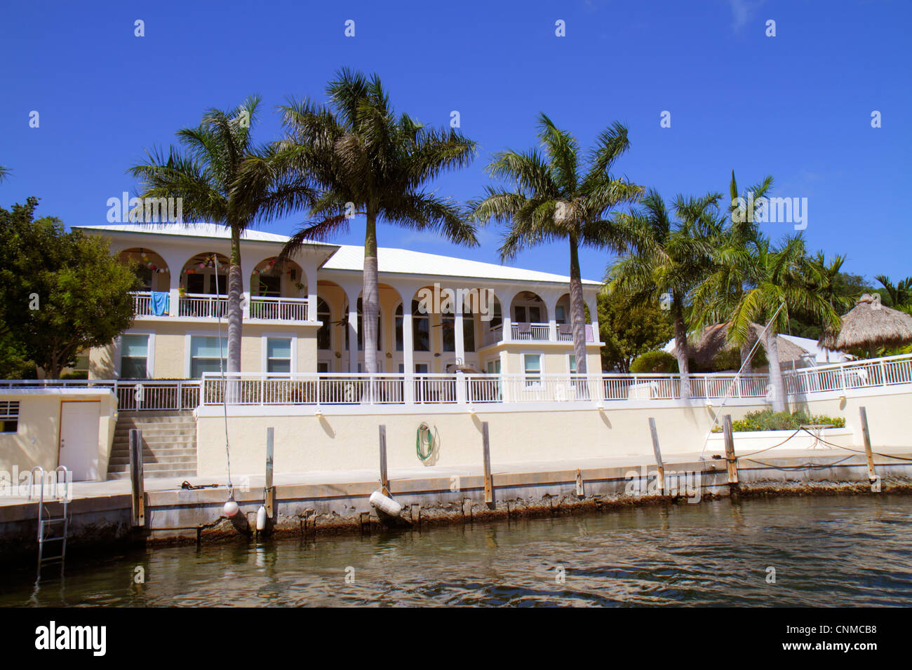 Florida Upper Key Largo Florida Keys, Largo Sound Canal, Häuser am Wasser, Palmen, Besucher reisen Reise touristischer Tourismus Wahrzeichen Land Stockfoto