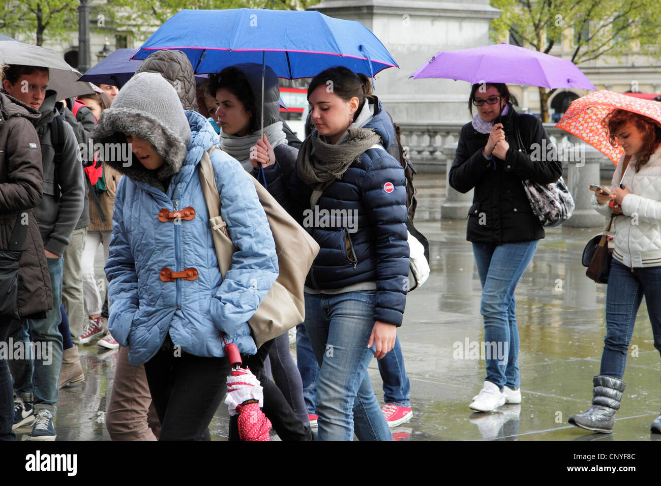 Touristen im Regen, London, UK Stockfoto