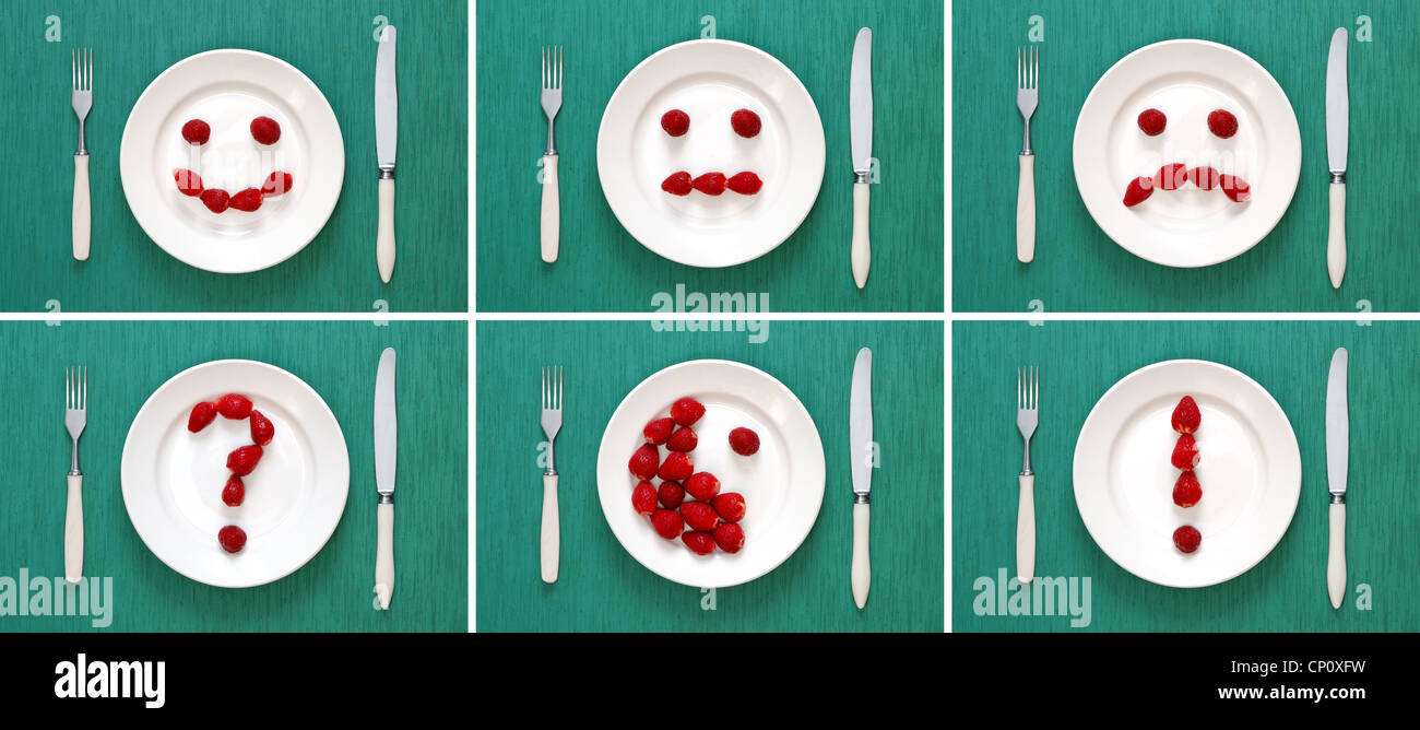 Food-Konzepte - Gesichter und Symbole der Erdbeeren auf Platte gemacht Stockfoto