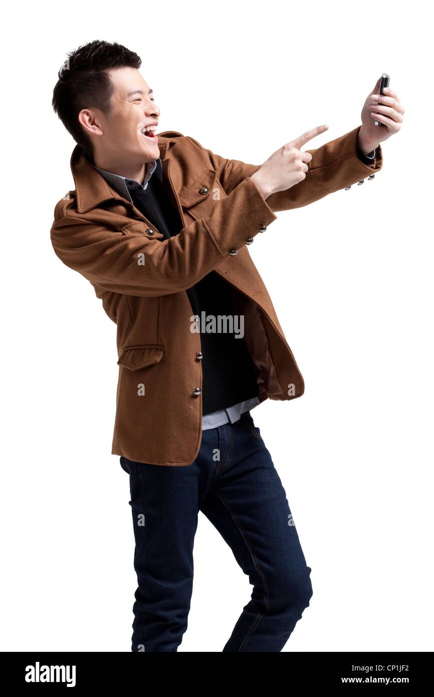 Stilvolle junger Mann mit Moblie Telefon Stockfoto